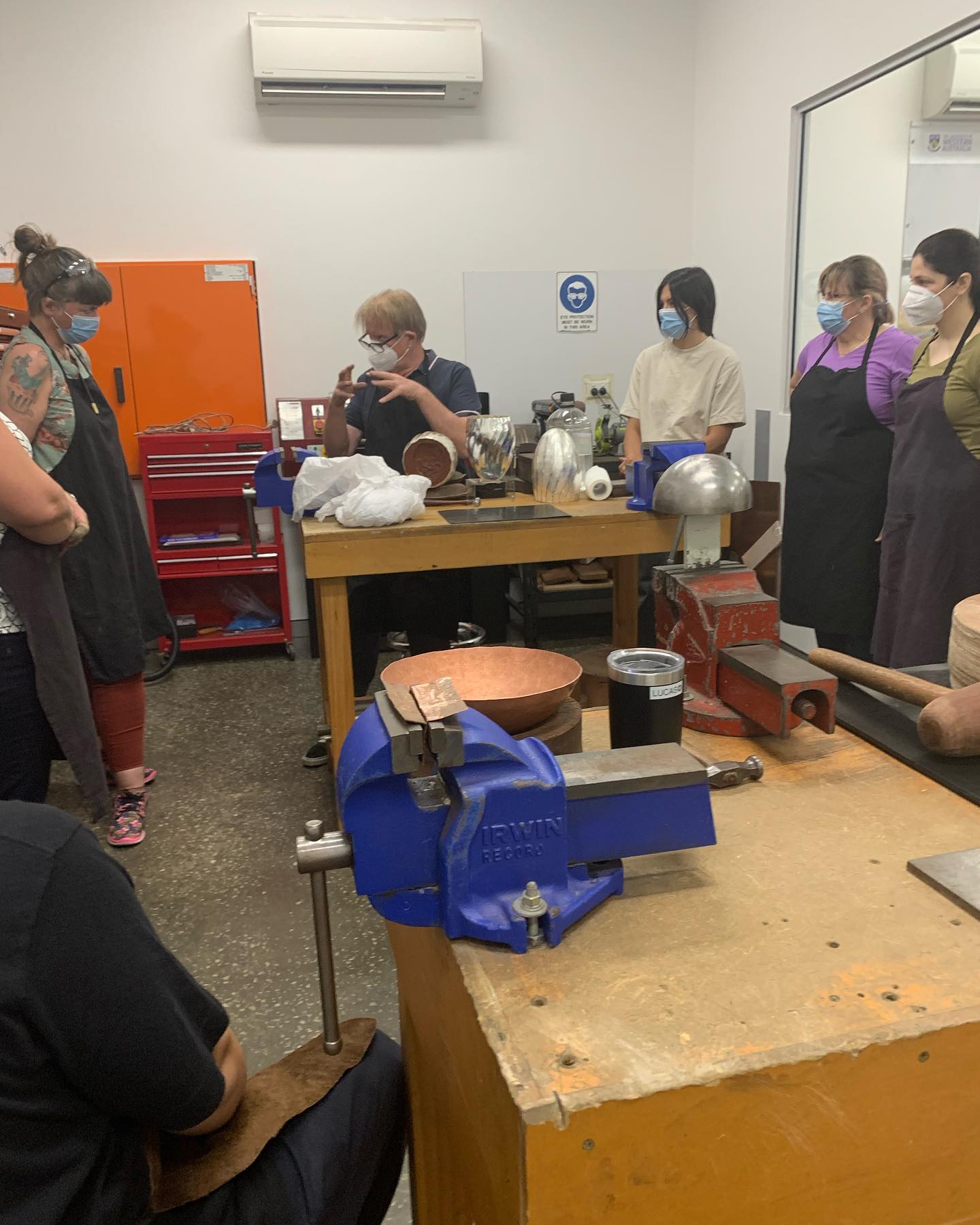Philip Noakes explaining to Friday jewellery students  how he raises vessels from a flat disc of silver and then applies surface texture #silversmith #handmade #silver #contemporaryart